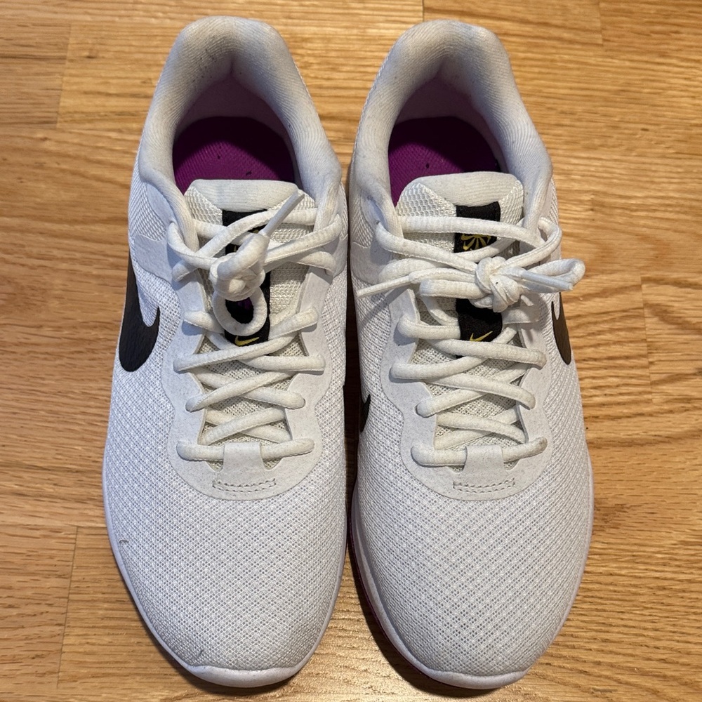 Nike Women's Revolution 6 White Sneakers with Black Swoosh and Purple Lining